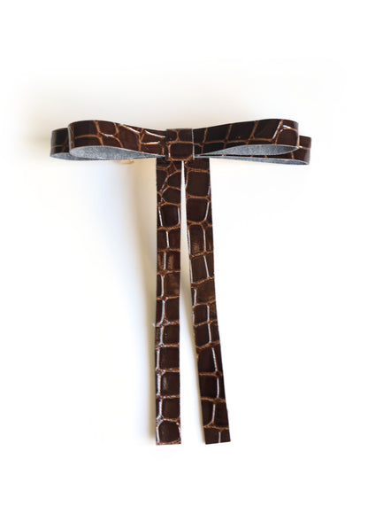 Boucle en similicuir sur barrette dorée