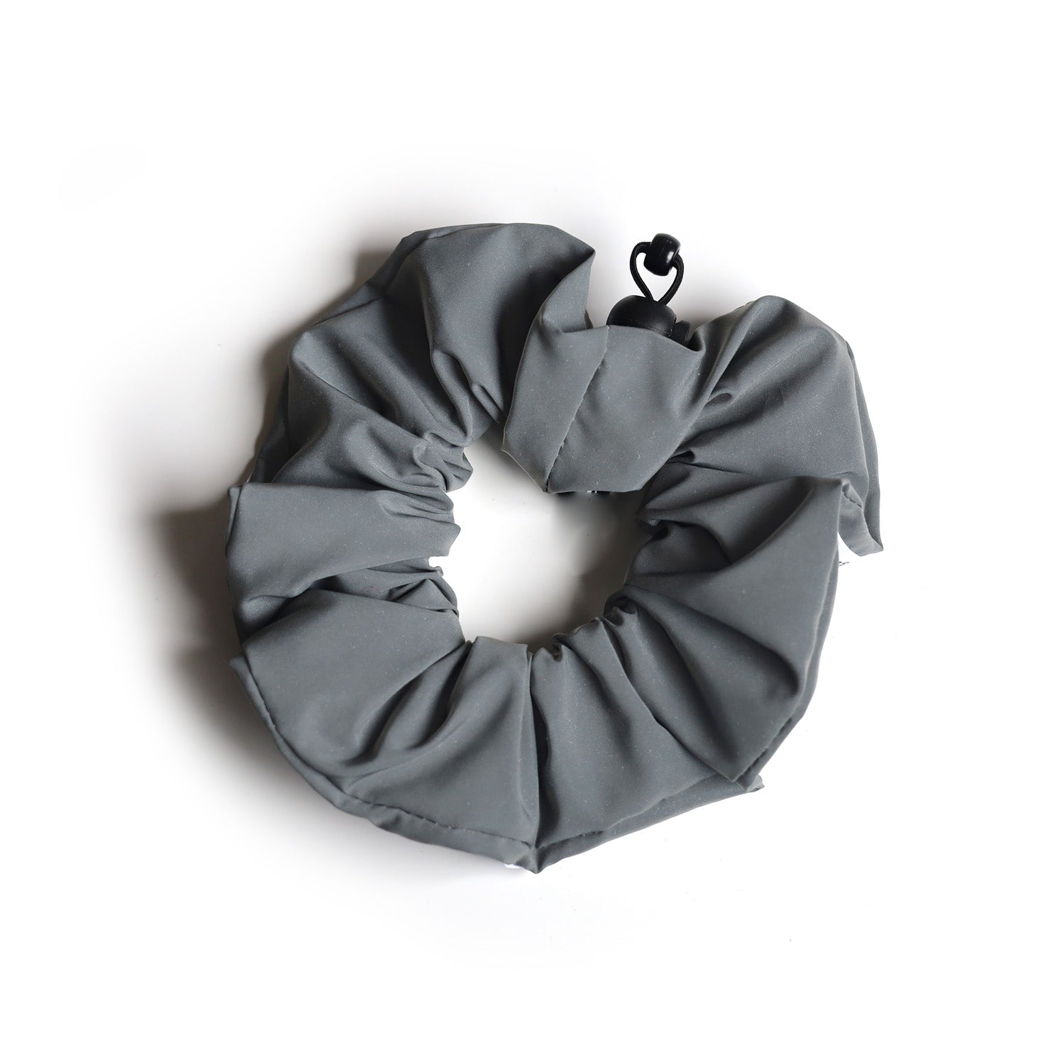 Reflective sports scrunchie with a secure hold