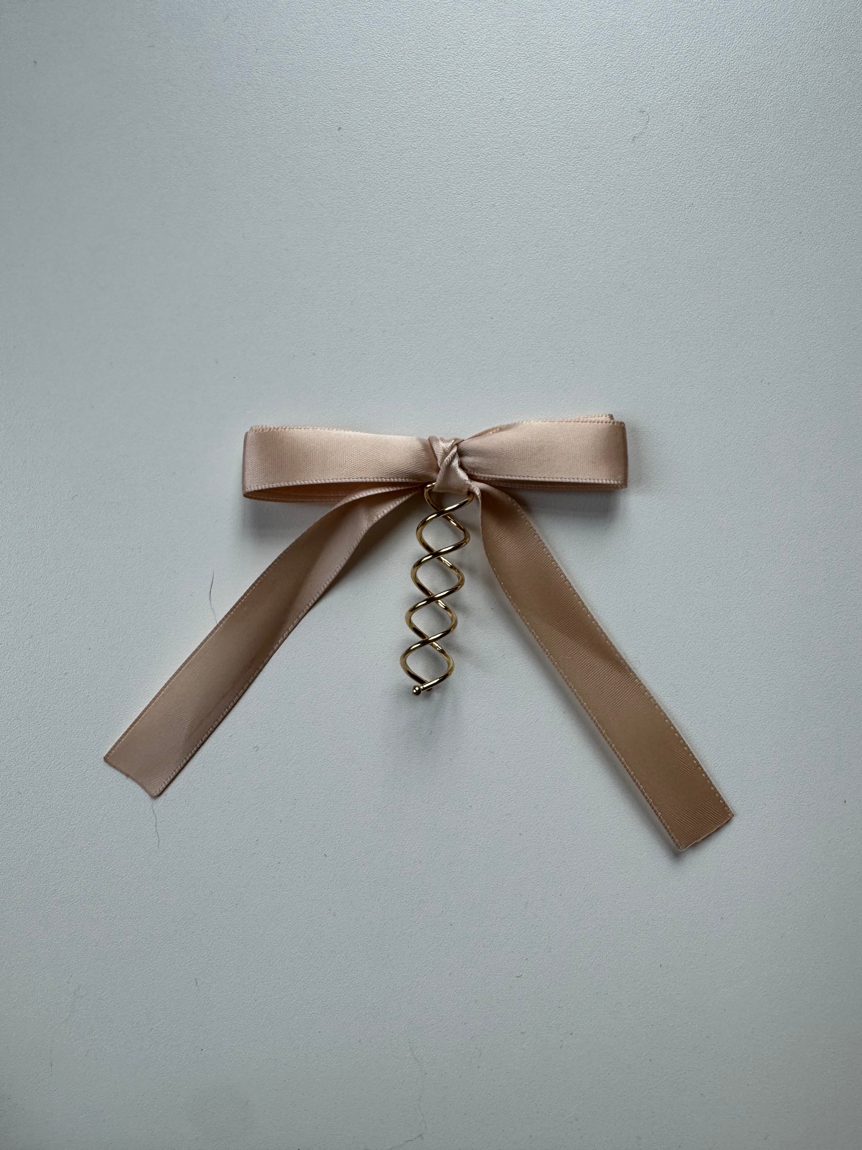 Échantillon - Boucle crème rosée sur spirale